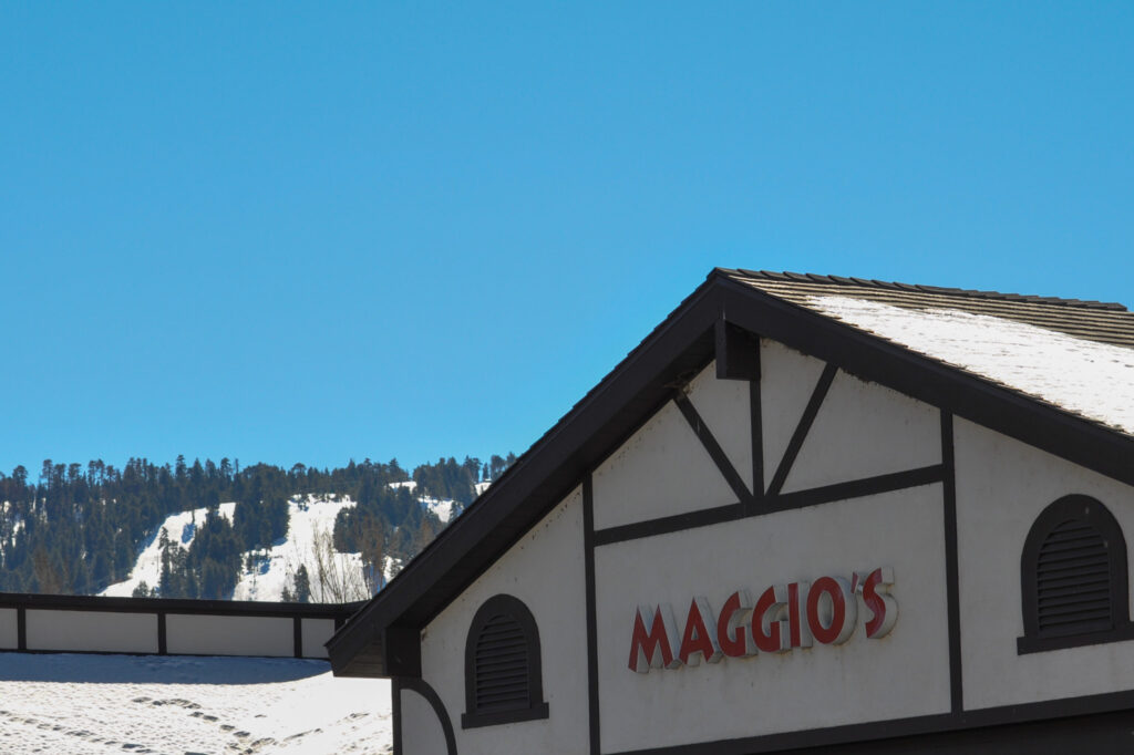 Maggio's Pizza Sign with Snow Summit in the background in Big Bear Lake