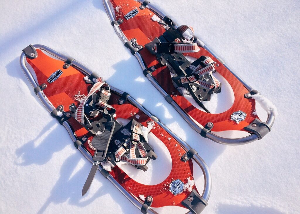 Red snowshoes on white snow